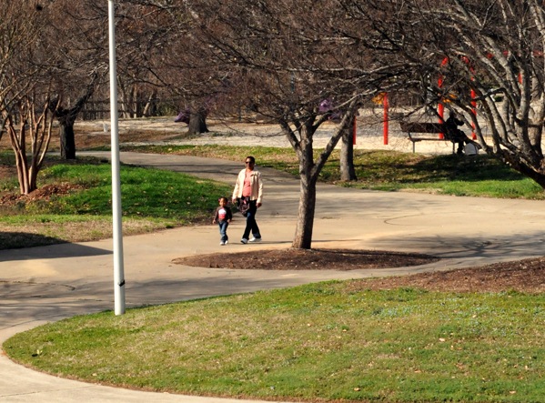 Some people enjoy a walk through Chavis Park 