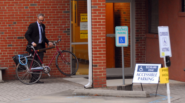 Ken Bowers, deputy city planning director, pulled up on his bicycle this morning to vote at the Trinity United Methodist Church on Bloodworth Avenue.
