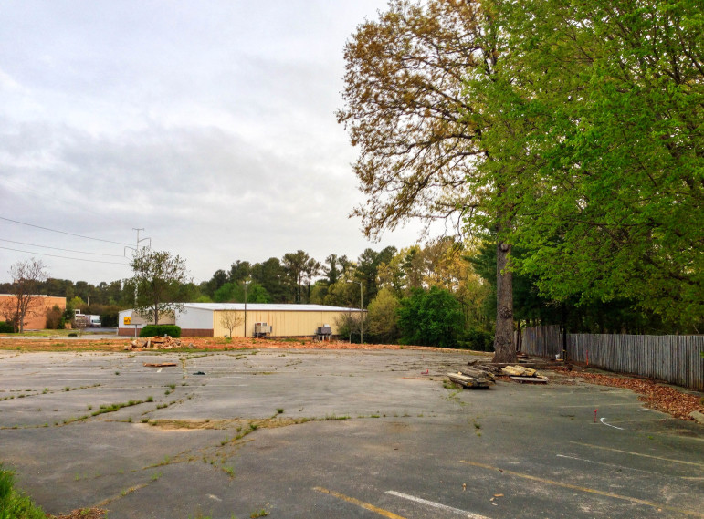 The empty lot where an Enterprise Auto Dealership will soon be joined by a car wash and detail building.
