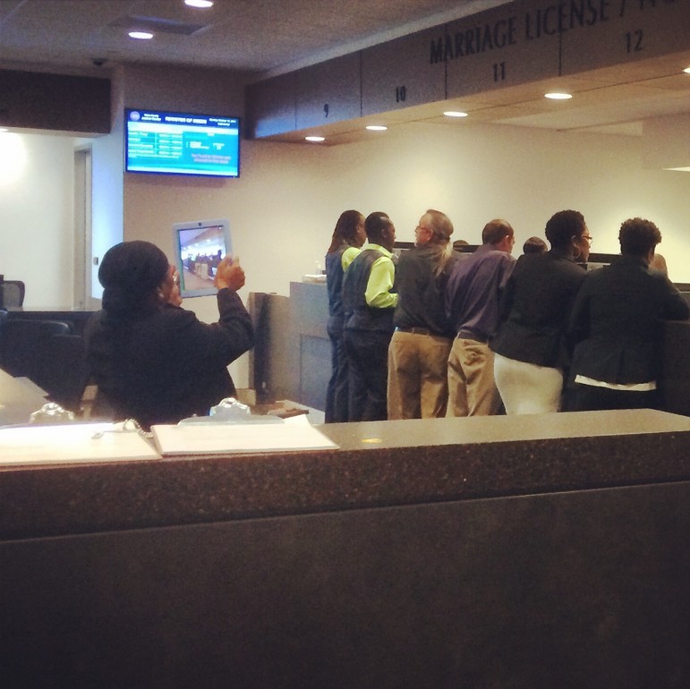 Busy, happy Monday morning at the Wake County marriage office as same-sex couples apply for marriage licenses.