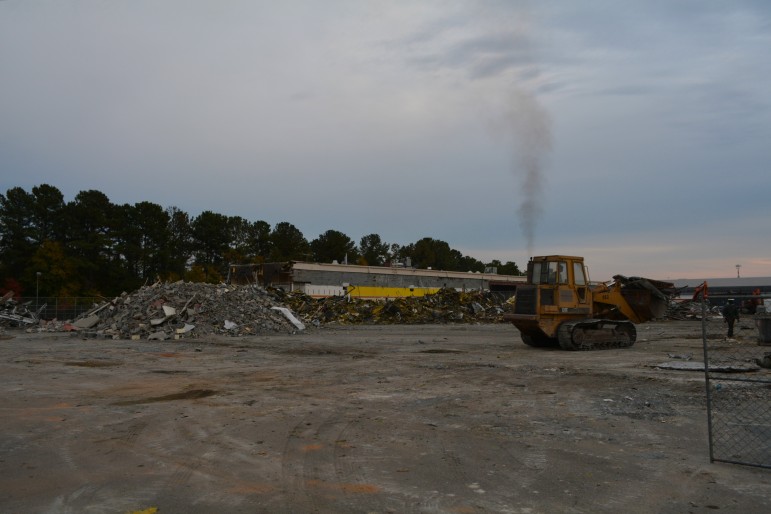 The former K-Mart is being torn down, piece by piece