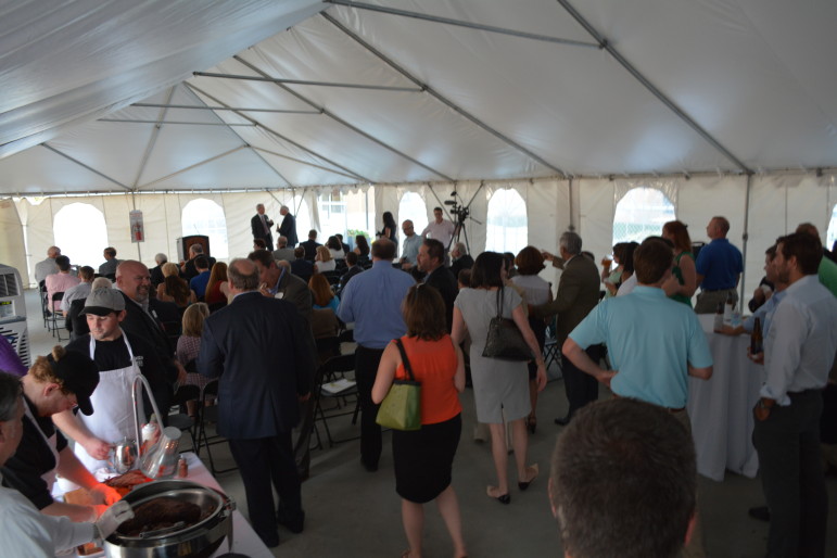 A large crowd was gathered in the outdoor tent next to the new Charter Square building Wednesday night
