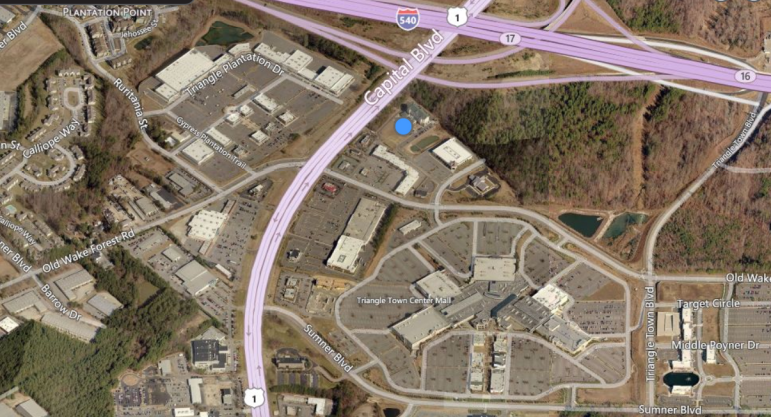 The blue dot indicates the empty lot where the new hotel will be built