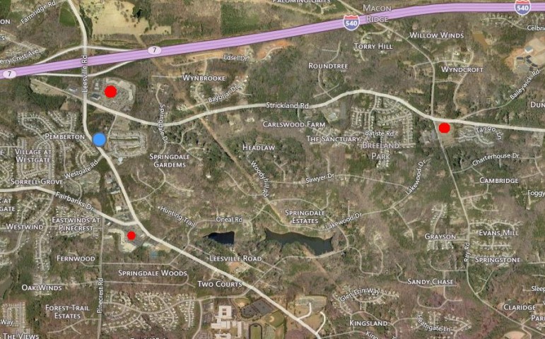 The blue dot indicates where the proposed shopping center would go. The red dots indicate existing grocery stores.