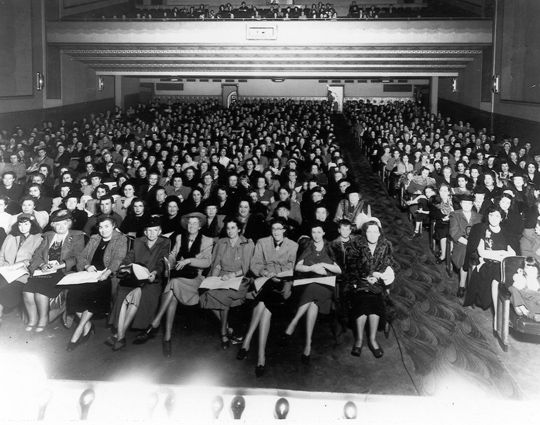 An audience of mostly women sits inside the air-conditioned Ambassador Theatre