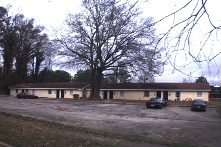 One of the existing apartment buildings on the site