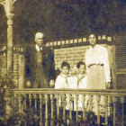 On the front porch of the Pope House from left, Dr. Pope Evelyn Pope, Ruth Pope and Delia Haywood Phillips Pope. Photo taken approx. 1915.