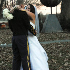 couple stands in Moore Square for Wedding photo