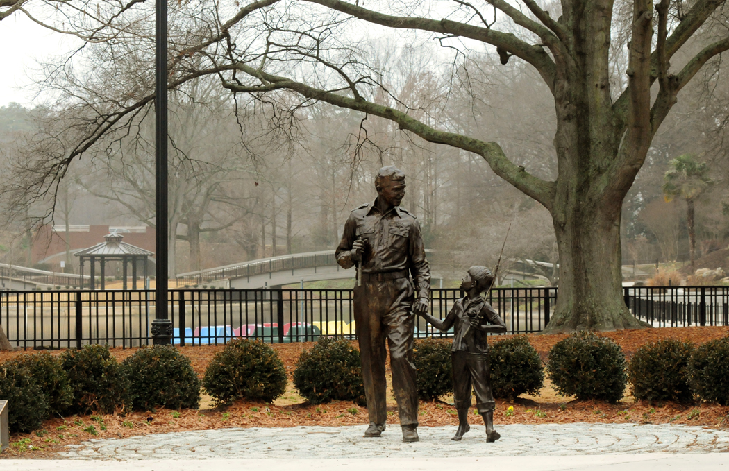 The statue of Andy and Opie stand alone Monday afternoon in the center of Pullen Park near downtown Raleigh, N.C.